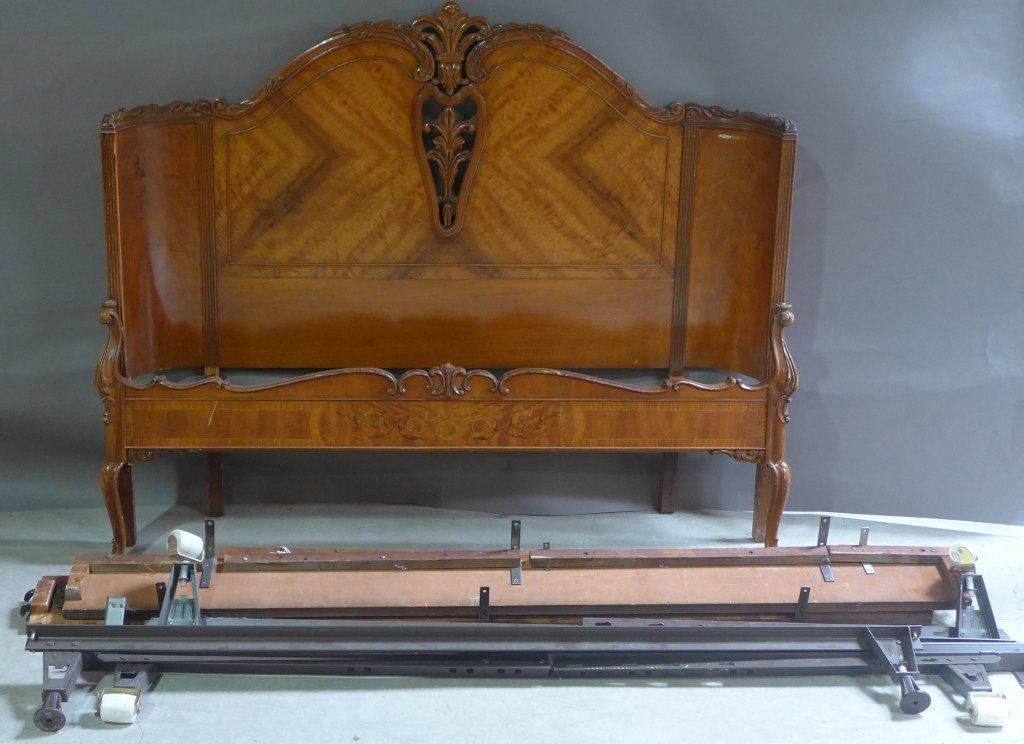 Beautiful Wood Bed: From the Estate of Mark Falk. Wooded bed with carved fleur de lis detail in center. Parquetry detail on foot board. Headboard wraps around at edges. Height: 46 1/2", Width: 56 1/4"