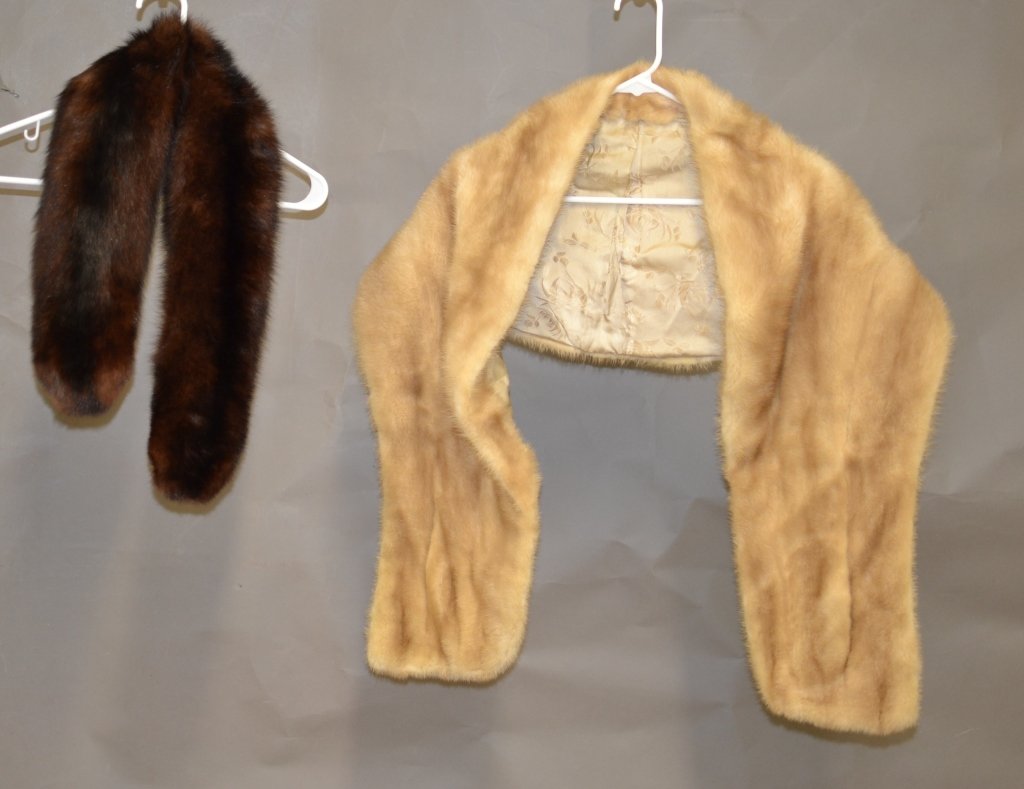 2 Fur Stoles: Both fur stoles are possibly genuine fur. Brown wrap has clips to connect closed. Length: 36" Light tan wrap has initials embroidered on inside and has 2 side pockets. Length: 63"