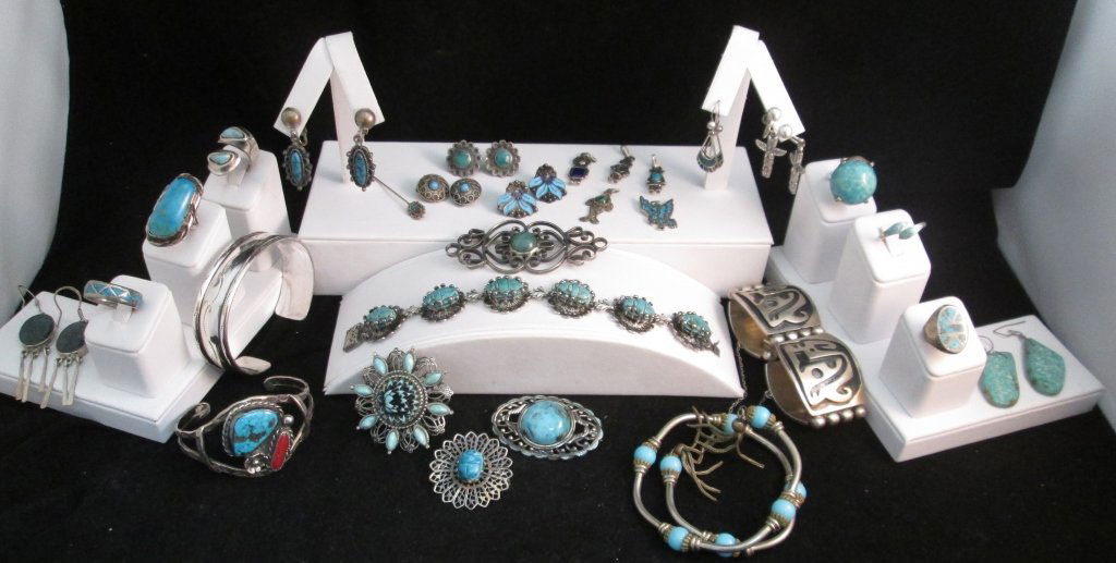 Collection of Turquoise and South Western Jewelry: Navajo style jewelry includes 29 pieces: 5 bracelets, 6 rings, 3 earrings for pierce ears, 5 clip-ons, 5 pins, and 5 charms/ pendants. most are sterling silver.