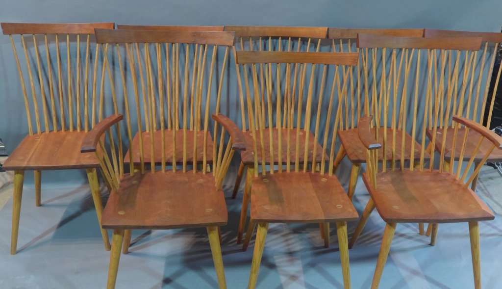 8 Eastward Dining Chairs, Thos. Moser: Turn of the century hand crafted dining chairs. The 4 tapered legs join the shaped seat w/ rods rising to the arms and the crest. Cherry and ash. 6 side chairs and 2 arm chairs. Signed and dated on bo