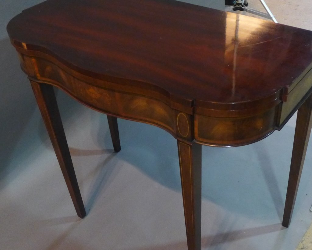 Console Table, Sheraton Style: Console with hinged top to open up into a larger table. Beautiful marquetry around apron of table as well as inlay at top of legs. Height: 29 1/2", Width: 38", Depth: 36"