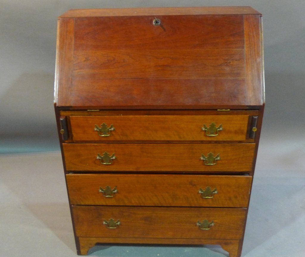 American Drop Front Desk: Antique drop front desk with 4 drawers. Brass hardware. Height: 42", Width: 30", Depth: 15"