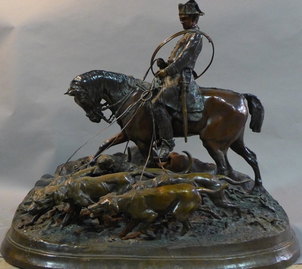 After Pierre-Jules Mene, French (1810- 1879): "The Hunt Scene" Patinated bronze sculpture. 20th Century. Signed on base: PJ Mene. The statue depicts a hunter sitting on horse riding with several dogs. Height: 28", Width: 26", Depth: 14 1/2"