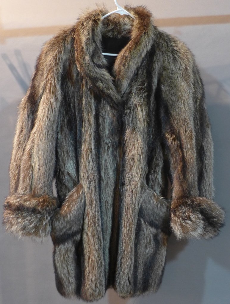 Dark Fur Coat: Vintage fur coat. Good overall condition. It has cuffed sleeves and side pockets. The name "Rhoda" is embroidered in the lining. There are no buttons closing the coat. Length: 38", Width: 21"