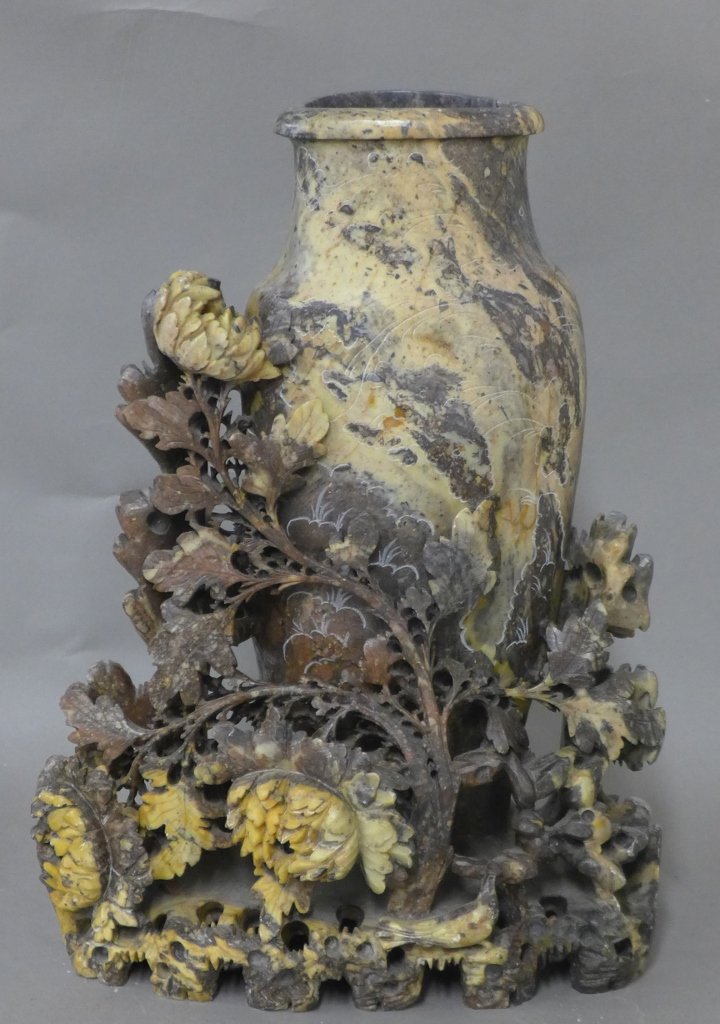 Carved Soapstone Sculpture: Asian sculpture. Hand carved vase and flowers. Beautiful etching on vase. May have slight chipping. Height: 12 3/4", Width: 9", Width: 4"