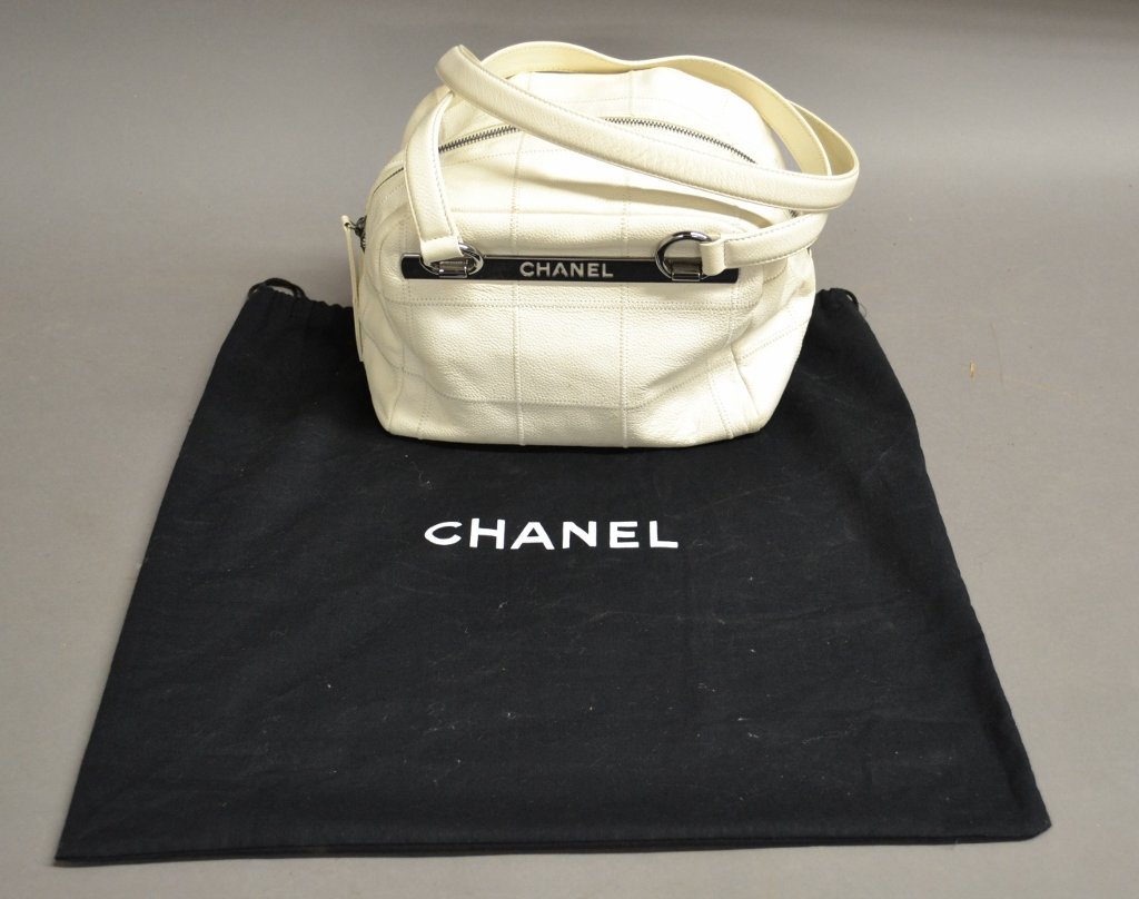 Chanel, Designer Purse: Chanel quilted square stitched white leather purse/ hand bag. Pre- owned. In excellent condition. Height: 6\", Width: 9 1/2\", Depth: 6 1/2\", Strap: 10\"