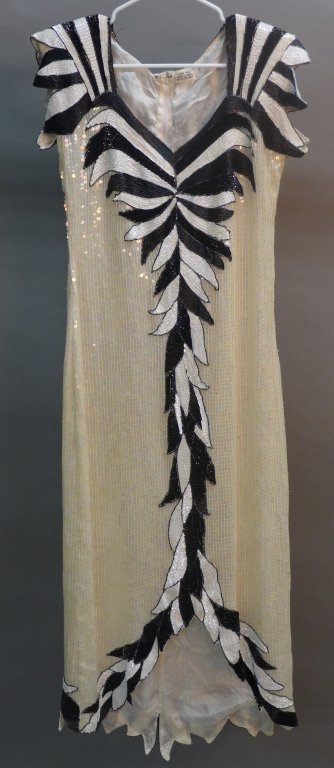 Vintage Sequin, Beaded and Silk Dress: Vintage iridescent sequin and black and white beaded silk dress. Made in India. Good overall condition, small tear in back seat area. Size Medium. Length: 53", Waist: 32"