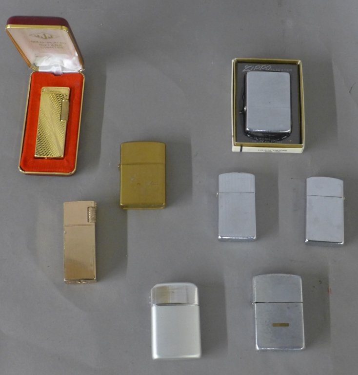 Collection of 8 Cigarette Lighters: Metal cigarette lighters. Collection includes: Dunhill, JJJ, Esquire, King, Halco, Ronson, 3 Zippos. 3 gold tones and 5 silver tone lighters. Height: 3 1/4", Width: 1 3/4"