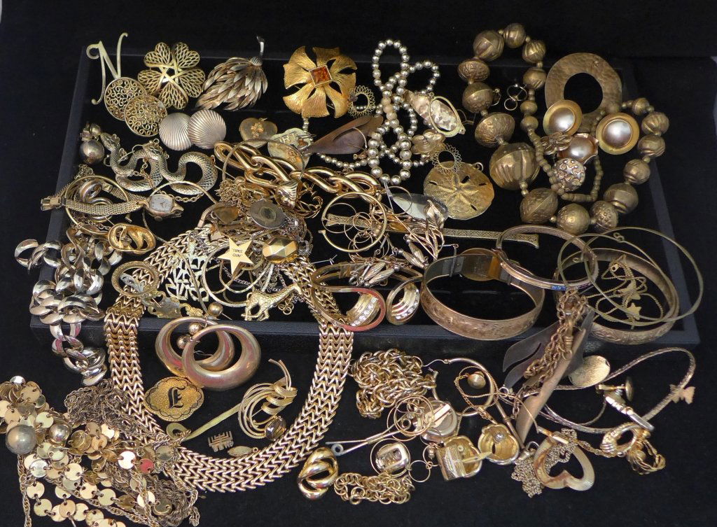Gold Tone Jewelry: Assortment of gold tone costume jewelry. Collection features necklaces, pins, bracelets, earrings, bangles and more.