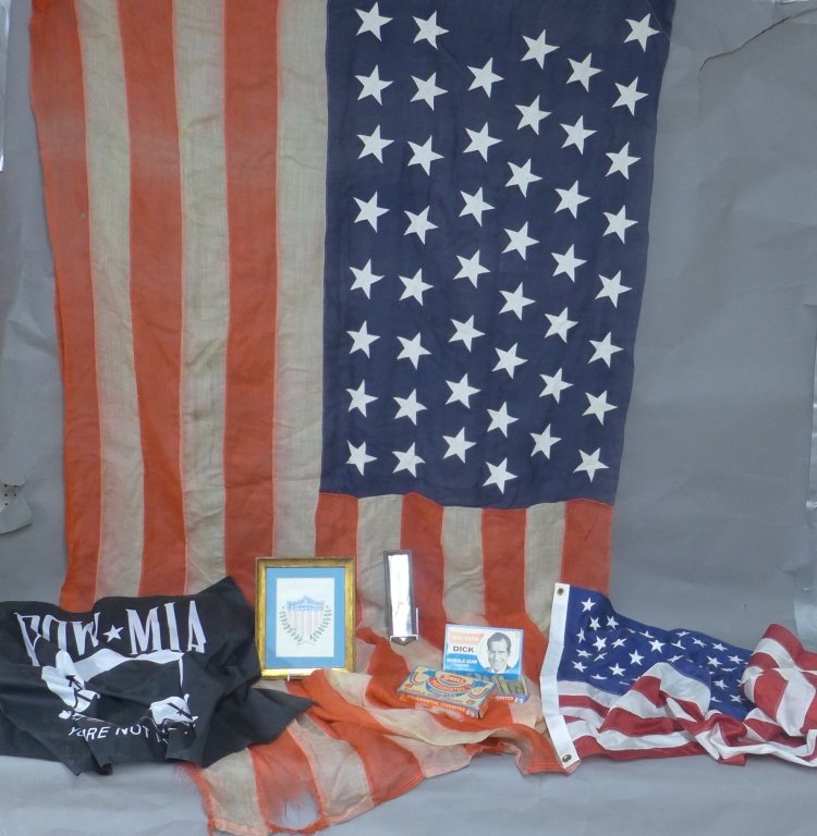 United States Patriotic Collection: Vintage flags and accessories. 1 POW MIA, 1 hand held flag, 1 modern flag, 1 large vintage flag (60" x 120"), centennial ribbon, bubble gum cigars and a framed drawing. Some discoloration, holes, tear