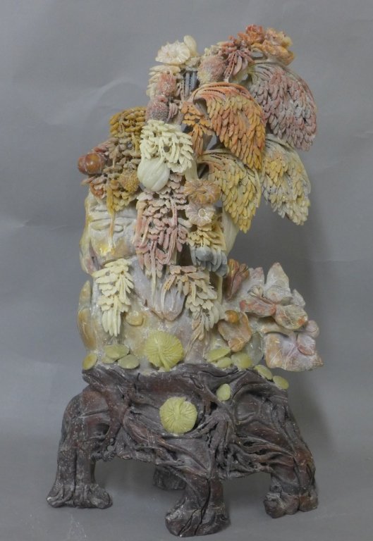 Carved Chinese Soapstone: Hand carved Soapstone. Intricate fauna with root base. In great condition. No noticeable maker's mark. Height: 18", Width: 10 1/2", Depth: 4"
