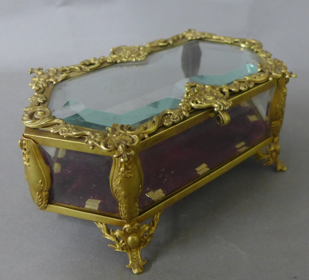 Antique Dore over Bronze & Glass Box: Antique dore over brass and beveled glass trinket box with hinged lid and velvet lined bottom. Height: 3", Width: 6 3/4", Depth: 4" (Continental, European, French, English, American, flowers,scroll wo
