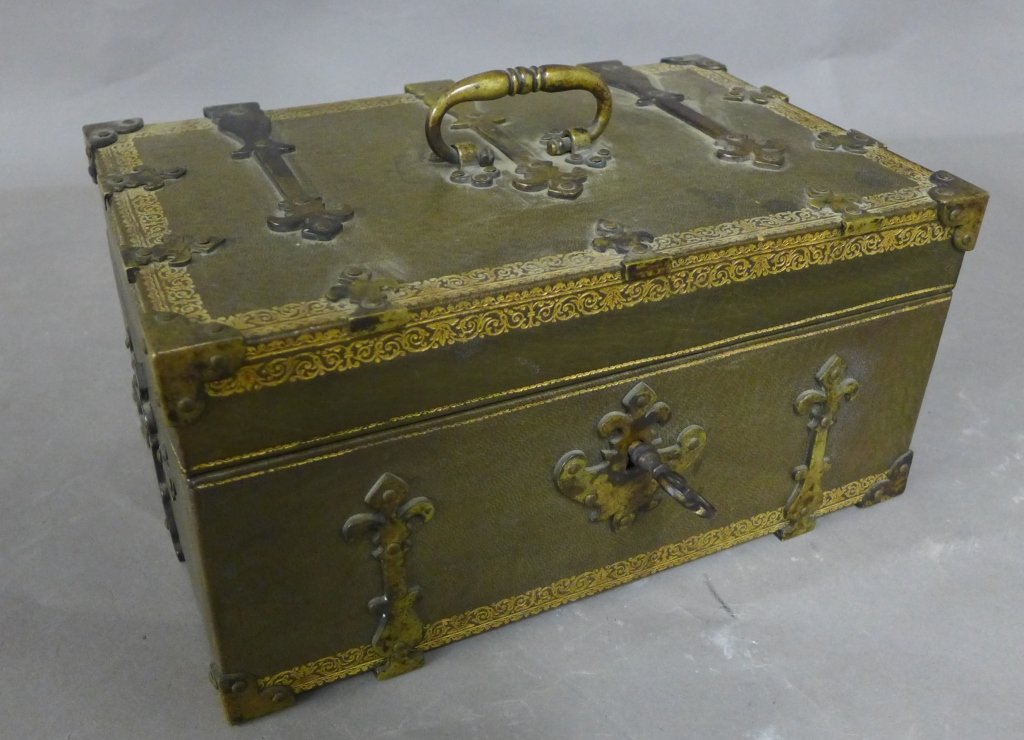 Antique Tooled Leather Box: Tooled and gilt leather box with patinated bronze mounts and hardware. Hinged lid. With key. Height: 5 1/2", Width: 10 3/4", Depth: 6 7/8" (Continental, European, French, English, American, gold, meta