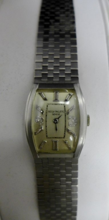 Patek Philippe Platinum & Diamond Mens Wrist Watch: Patek Philippe Platinum & Diamond Men's Wrist Watch. Platinum Case with 14k band / bracelet / belt. Geneva Switzerland. Style no. 200442. 8 Adjustment. 14k belt. 10% Platinum IRIP. 10 baget D. weight