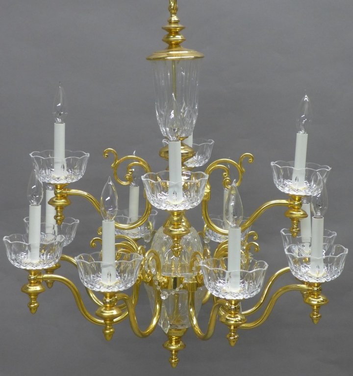 Gilt and Glass Chandelier: Gilt metal chandelier with glass bobeches and center column. 12 lights. Height (not including chain): 30", Width: 27", Depth: 27" (lighting, light, electric) STERLING ASSOCIATES STRIVES TO PROVIDE ACC