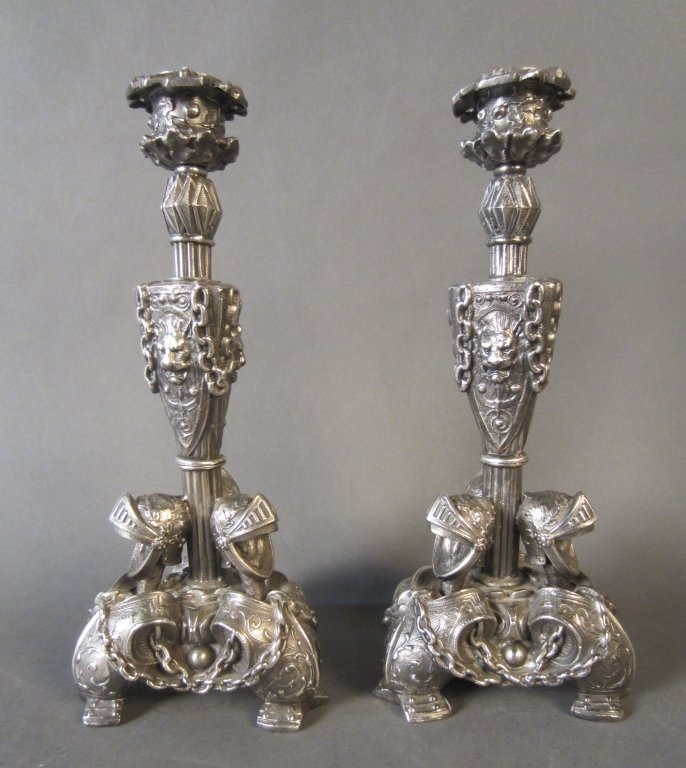 Pair Silvered Metal Figural Candle Sticks: Pair silver plate ornate figural candle sticks. Height: 10 3/4", Width: 4 1/2" (lighting, medieval, chain, amour, candle) STERLING ASSOCIATES STRIVES TO PROVIDE ACCURATE, OBJECTIVE, & FAIR INFORMATION