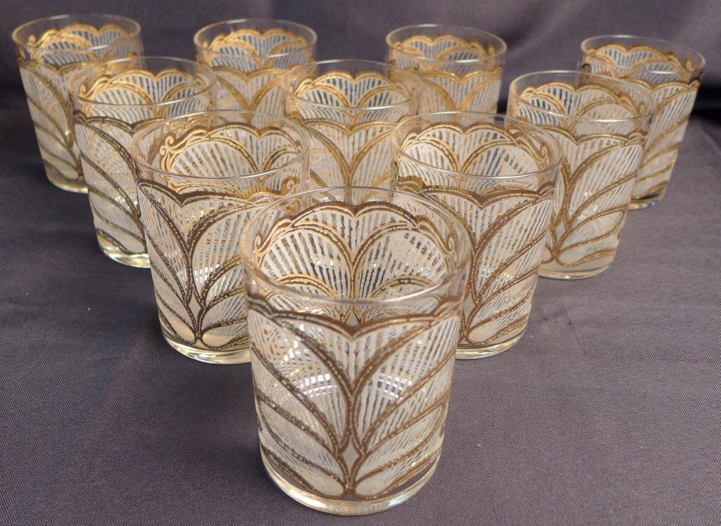 Collection of 10 Art Deco Rocks Glasses: Raised gilt Art Deco pattern, designed by Georges Briard. France, c. 1950s; marked "georges briard" on each glass. Some of the signatures have worn almost completely away. 1 noticeable chip on rim of