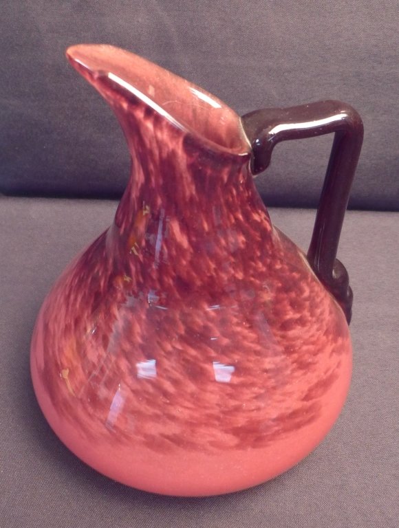 Schneider Art Glass Pitcher: Charles Schneider Jades Purple Ewer. Powder glass pink glass ewer with powdered violet glass accents. Applied violet handle. Signed Schneider. Height: 9", Width: 8", Depth: 8" (art glass, art deco, ar