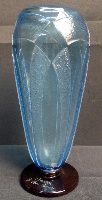 Art Deco Glass Vase: Art Deco translucent blue glass vase with applied violet base. Blue glass has beautiful acid etched stylized geometric design. Signed on base Le Verre Francais and Charder. Height: 12", Width: 4 1/2"