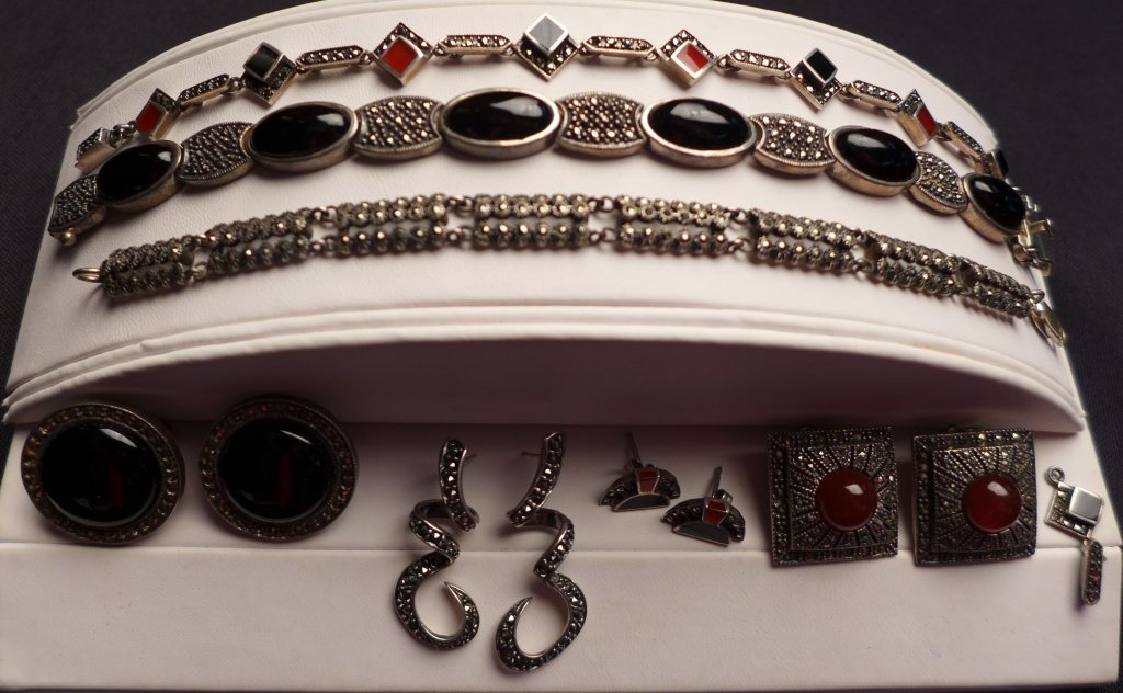 Collection of Art Deco Sterling Silver Jewelry: Art Deco sterling silver, marcasite, onyx and red coral jewelry assortment including 4 pairs of earrings and 3 bracelets. Marked Sterling on back. (modern, mid Century, 20th C, bangles, pierced ears, 