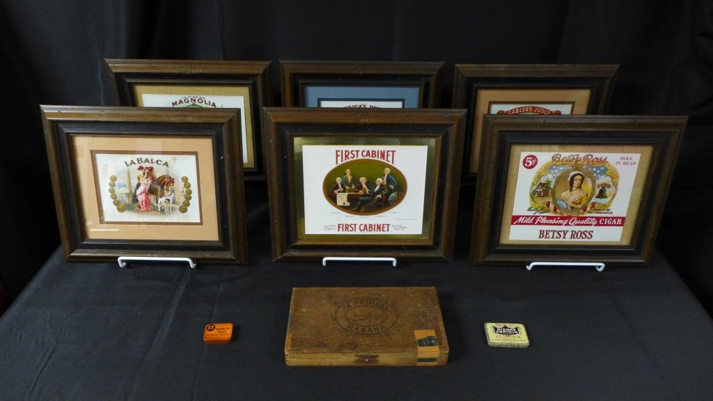6 Cigar Box Labels, Lithographic Art: Set of 6 framed cigar labels/ lithographs with 1 cigar box and 2 small tins. Each has a certificate of authenticity on back. Marks on 1 print and minor wear to frames. Height: 11 3/4", Width: 13 3/4"
