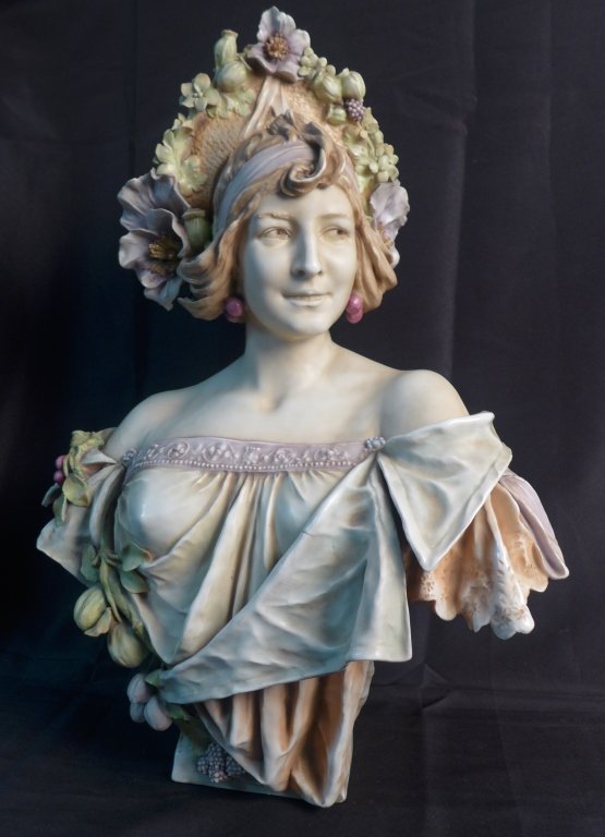 Attributed to Amphora Turn Teplitz Bust: Antique Art Nouveau porcelain bust of woman in floral hat. Most likly Turn-Teplitz Bohemia by Riessner, Stellmacher & Kessel Amphora Co. No noticeable maker's marks. Some imperfections. Height: 26", W