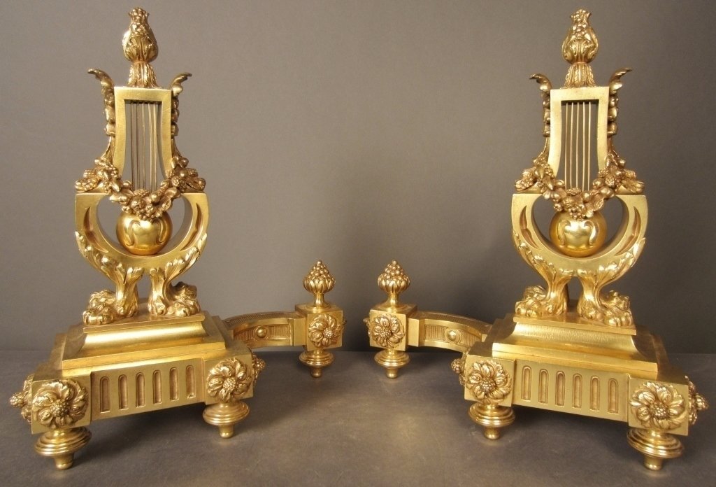 Pair French Dore over Bronze Chenets, 19th C: Pair French 19th century dore bronze chenets. Height: 16 ½", Width: 14" (Antique, andiron, garland, gold, gilt, metal) STERLING ASSOCIATES STRIVES TO PROVIDE ACCURATE, OBJECTIVE, & FAIR INFORMATION O
