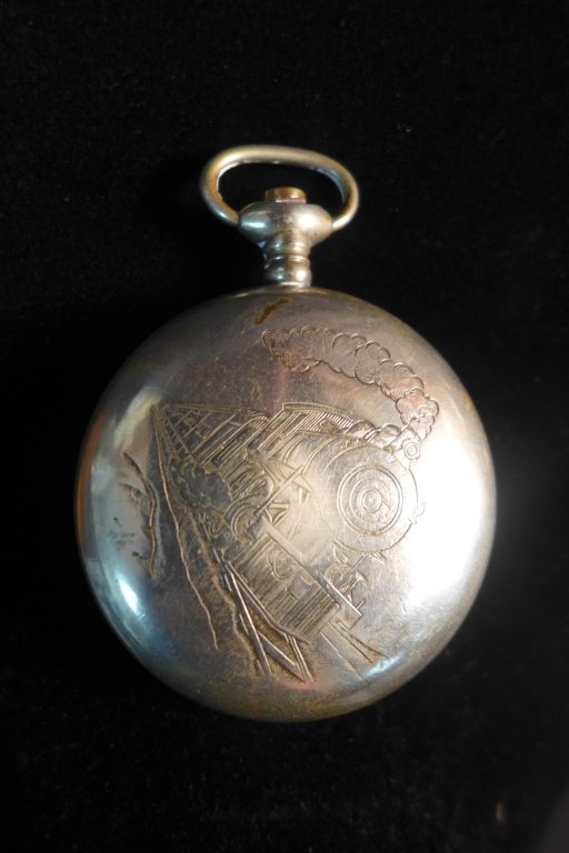 Waltham Pocket Watch: Antique pocket watch with maker's label on dial. A. W. Co. Waltham. Back of case is engraved with image of a train. Missing top knob. Height: 2 3/4", Width: 2", Depth: 2" (time, decorative accessory, 