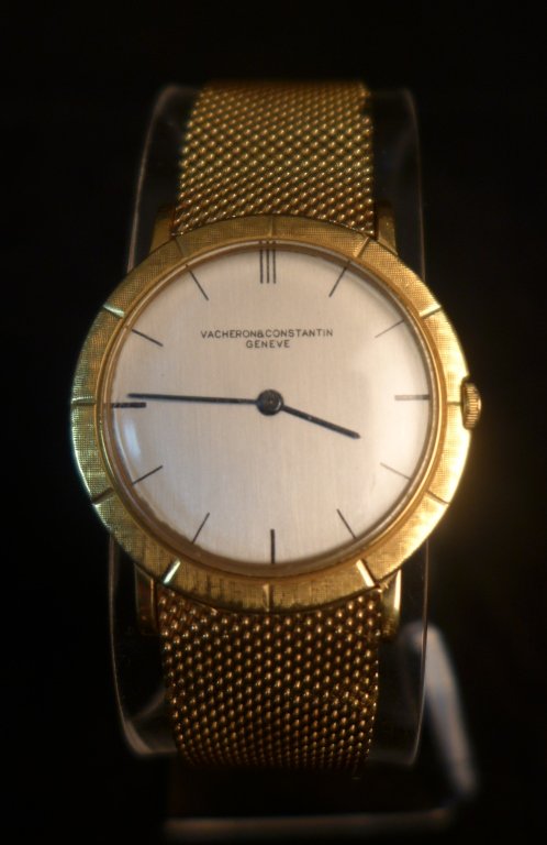 Vacheron Constantin Geneve 18K Men's Watch: Vacheron Constantin Geneve 18K Yellow Gold Men's Wristwatch. Round face has a pearlescent tone. Manual wind. Gold bracelet is marked "dgs 18k".Imperfections.Total weight: 55 grams.Length: 7 3/8; Width