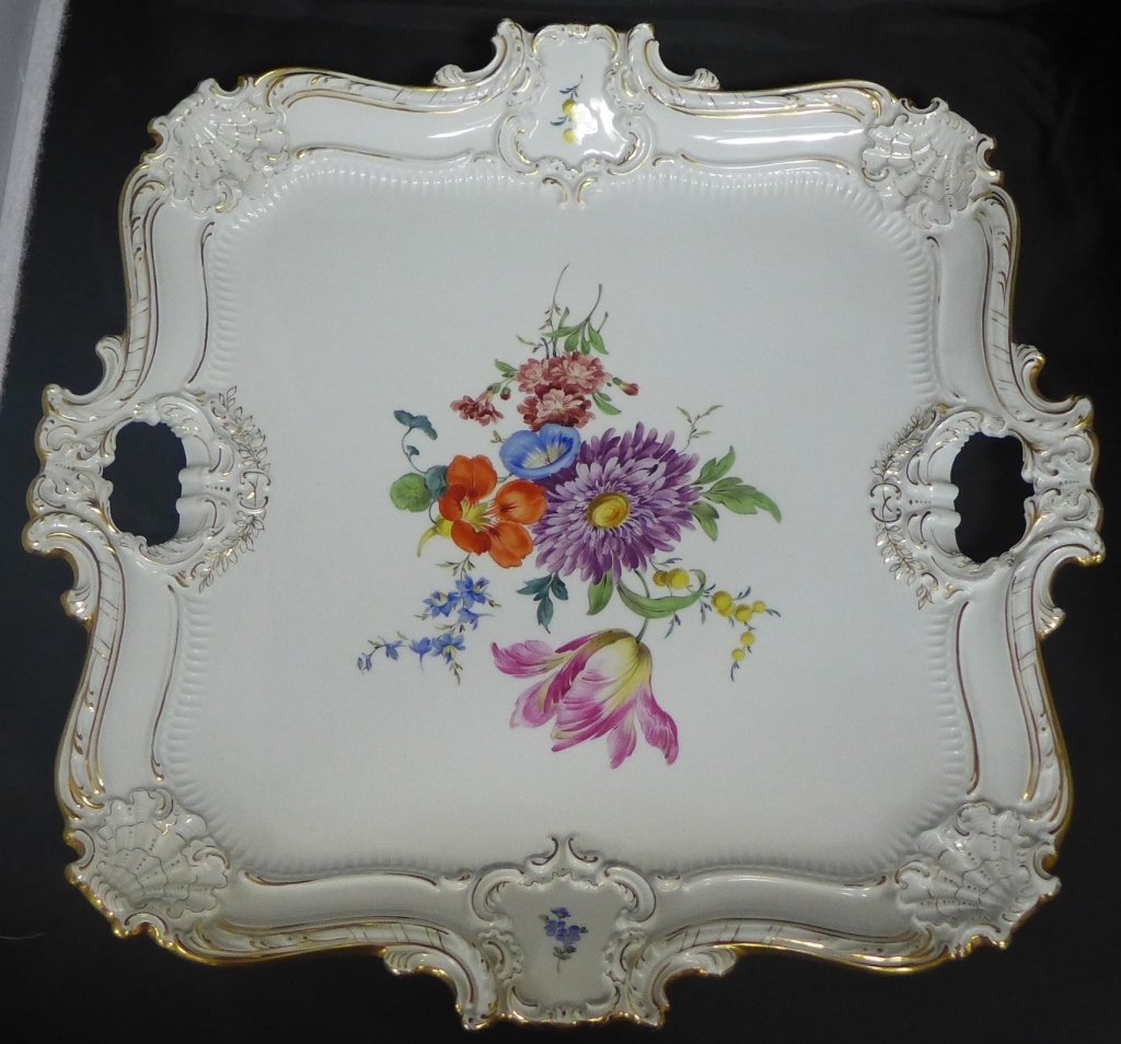 Antique Meissen Porcelain Tray: Stunning hand painted porcelain tray with central floral design and gilt accents around the boarder. Handles on either side of the large tray. Sculpted scallop shell detail on all four corners. Crosse