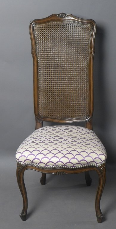 Beautiful Accent Chair: Louis XV style caned wood chair with upholstered seat. Scalloped design embroidered in shades of purple on white ivory padded cushion. Nail head design. Tall back has canning. Wood frame has carved de