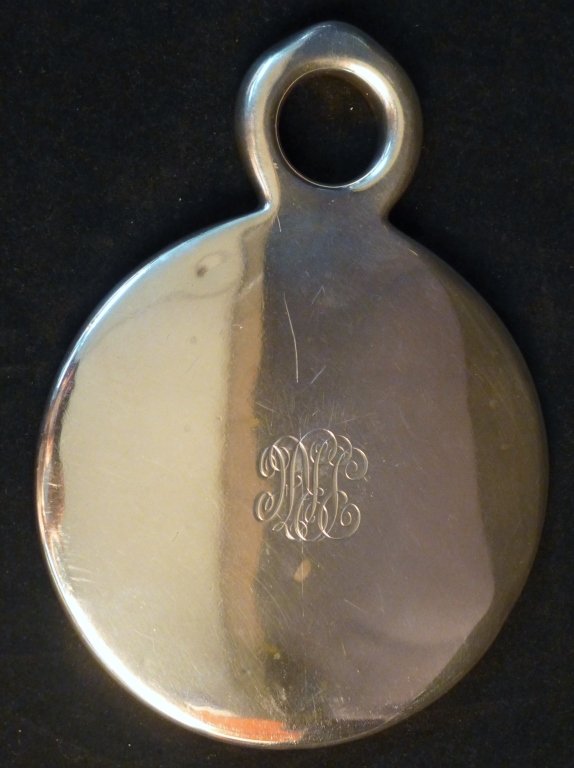 Tiffany & Company Sterling Silver Hand Mirror: Vintage Tiffany & Co sterling silver vanity dresser mirror. Monogram on back of mirror: "PRH". Some surface scratches on back and wear to mirror. Marked Tiffany & Co on edge of handle. Circa 1950s. Im