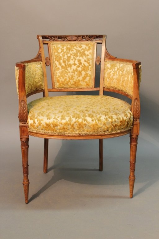 Antique Adams Style Boudoir Chair: Elegant Louis XVI style upholstered boudoir chair with curved back. Decorated with carved ornament on the back and tapered fluted legs with yellow silk and velour upholstery. Imperfections. Dimensions