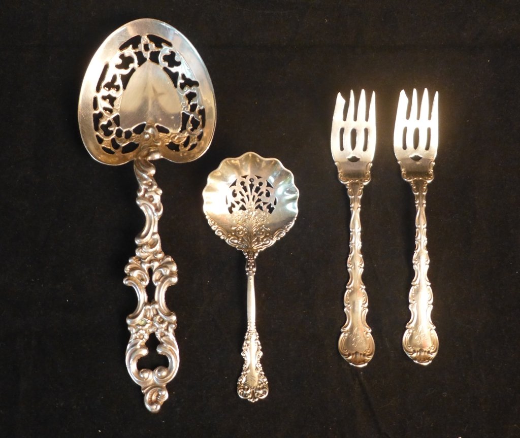 Collection of Sterling Silver Serving Pieces: 4 ornate sterling silver serving utensils including 2 forks & 2 serving spoons. Both spoons have lovely pierced designs in bowl. Smaller serving spoon and both forks have engraved monogram on base of 