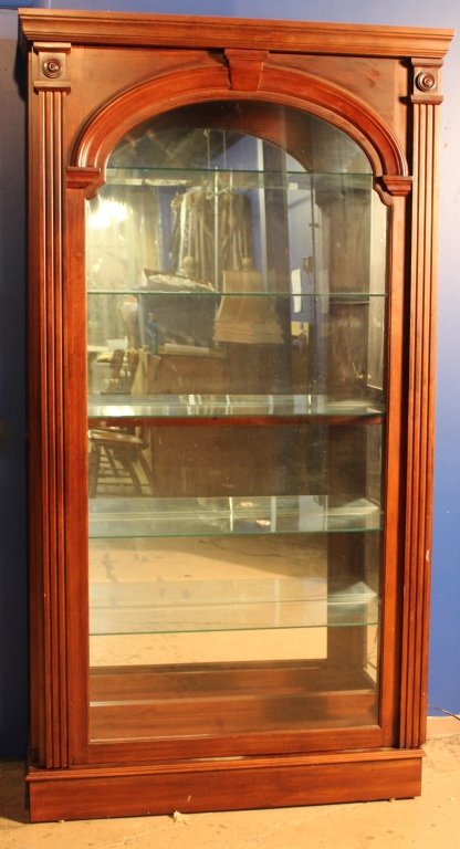 Curio Cabinet with Sliding Glass Door: Mahogany curio/china cabinet with sliding glass door in front. The door has elegant arch design. On the interior cabinet has 5 adjustable glass shelves, as well as a lights with two settings. Dimensio