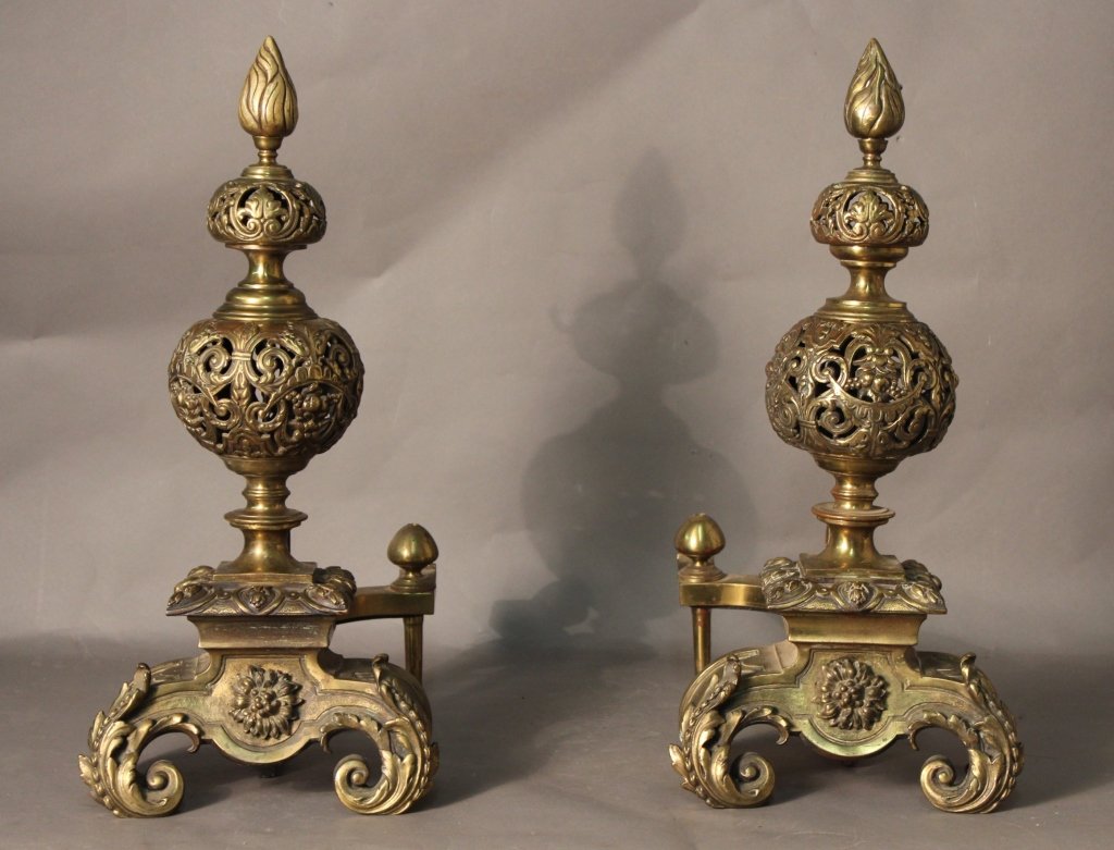 Victorian Bronze Fireplace Andirons: Vintage bronze fireplace andirons with artichoke finials above scrolling and foliate decorated pierced ball body that standing on two curved legged base with apply leafy decoration and central flower 