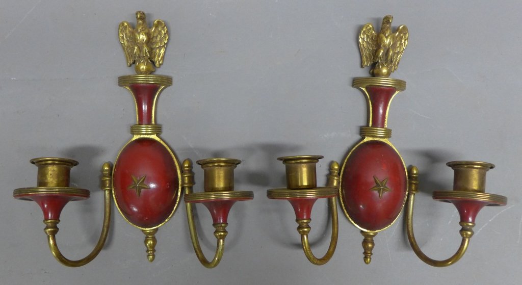 Pair Caldwell Sconces and Drawings: Gilt and and red polychrome over wood sconces. Bronze accents and mounts. Marked with Caldwell maker's mark on back. 1 arm is slightly bent. Imperfection. Height: 12", Width: 10", Depth: 4 1/2" Associ