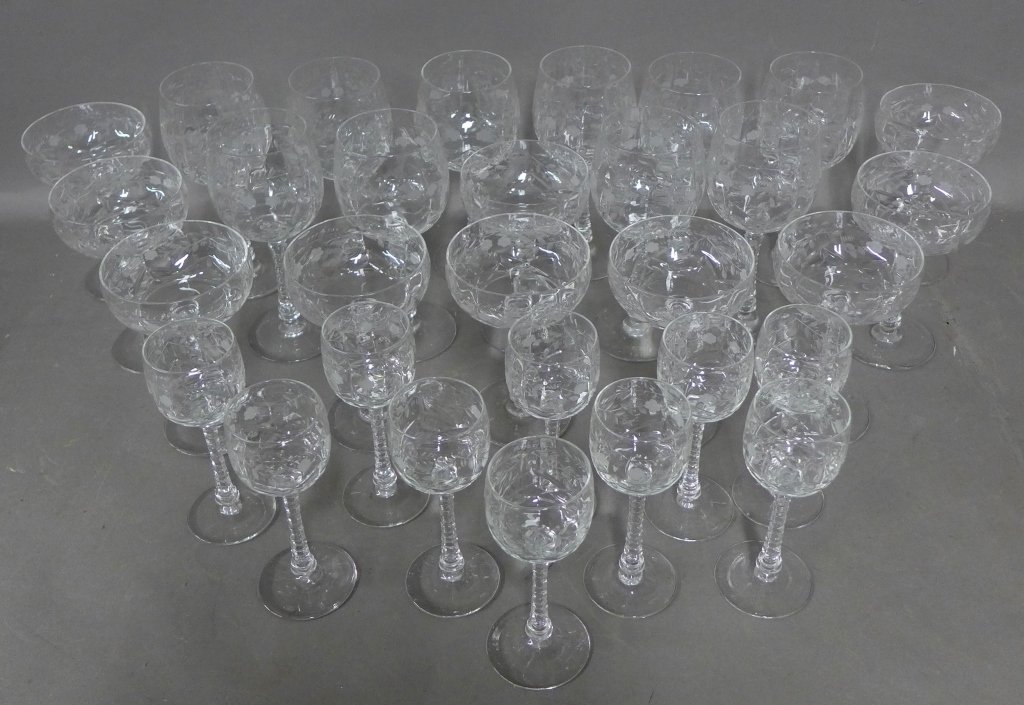 Collection of Stemware: Lovley set of stemware with delicate floral wheel cut design. 30 pieces total include 10 wine, 10 champagne & 10 liquor. Height of wine glass: 7 1/2", Height of champagne and liquor glasses: 6" (glass