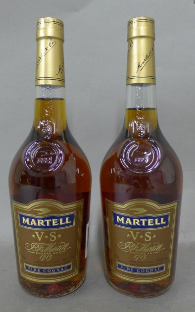 2 Bottles of Martell Fine Cognac: Martell V.S. fine cognac, founded in 1715. Both bottles are 40% alc/vol. Produced and bottled in Cognac France. Height of bottle: 11 1/4", Width: 3 1/4" (alcohol, liquor, French) STERLING ASSOCIATES S