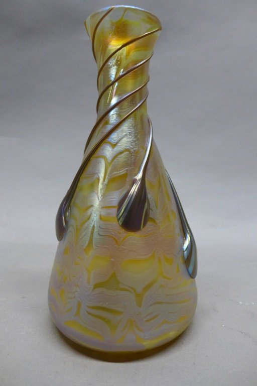 Loetz Phaenomen Art Glass Vase: Lovely amber iridescent glass vase decorated with a gold undulating pattern and applied caramel swirling tear drops with iridescent striations. Marked on bottom: Loetz Austria. Height: 9 1/4", Diamete