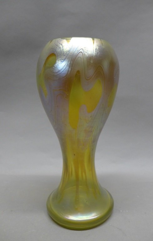 Large Loetz Vase: Beautiful Loetz art glass vase. Amber iridescent glass decorated with a gold and silver undulating pattern. Elegant symmetrical form with flared foot base. Maker's mark on bottom: Loetz Austria. Heigh
