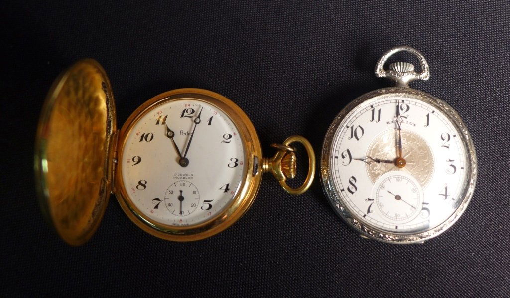 Hamilton and Pedre Pocket Watches: Two pocket watches. Pedre 17 jewels pocket watch is in gold tone hunter case. Inside of case is incised: Remontoir Ancre Ligne Droite 17 Rubis. Hamilton pocket watch is in silver tone open faced case.