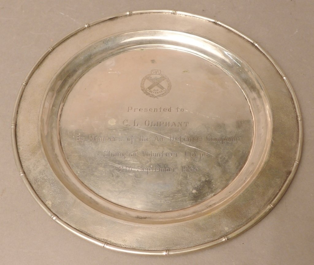 S.V.C. Air Defence Silver Trophy Plate: Shanghai Volunteer Corps Air Defence Silver trophy plate made and stamped on the bottom " Tuck Chang". Featuring bamboo style trim with engraving in the center " Presented to / C.L. Oliphant / By memb
