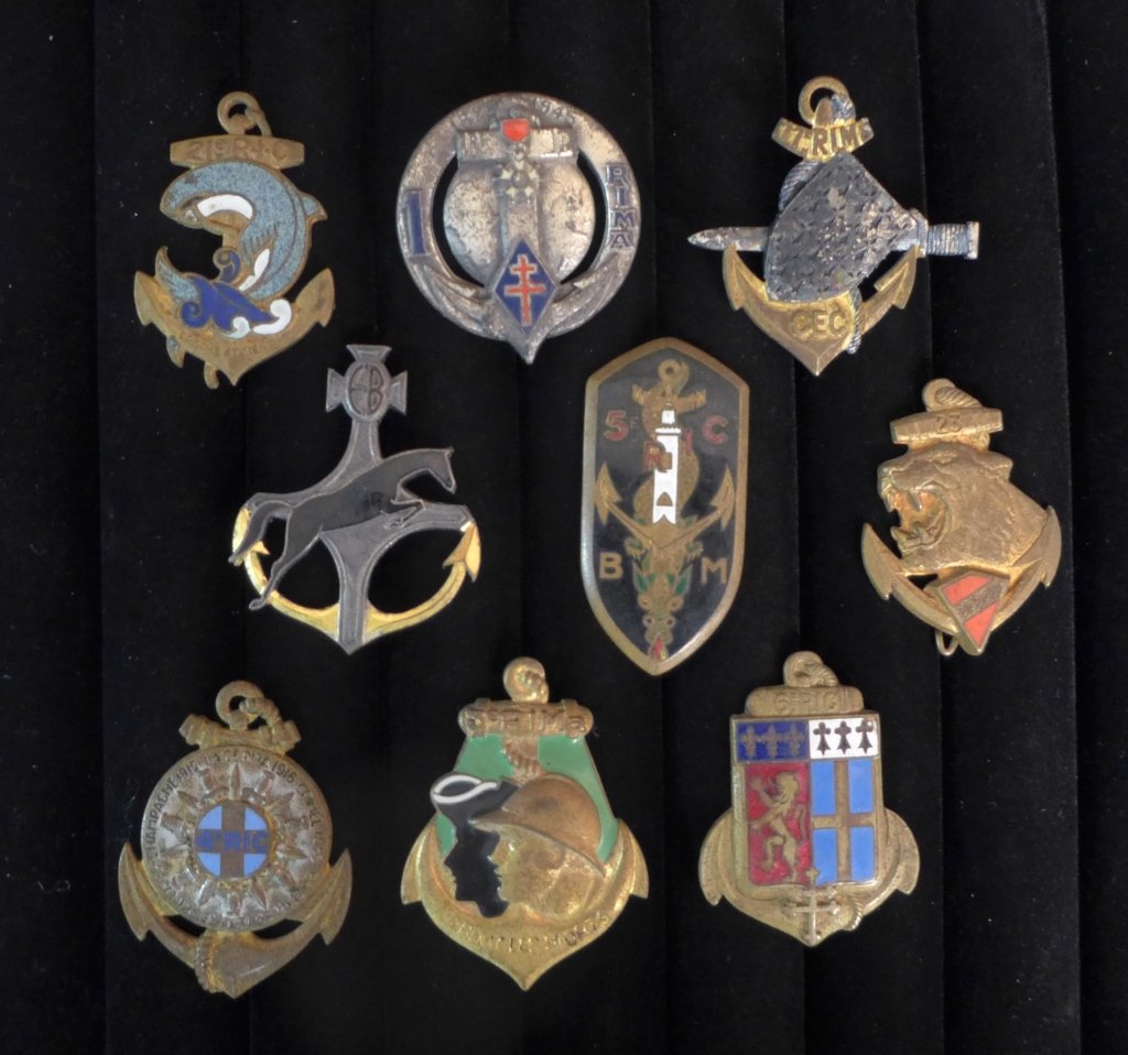 French Colonial Infantry Regiment Badges: Collection of 9 Colonial Infantry Regiment Badges. Includes: 1st, 3rd RIMa, 4th RIC, BM/5 RIC (D.OM), 6th RIC, 6 RIAOM (Esc blinde), 11th CEC, 21st & 23rd. Height: 2" ; Width: 1 7/8". Age appropriate 