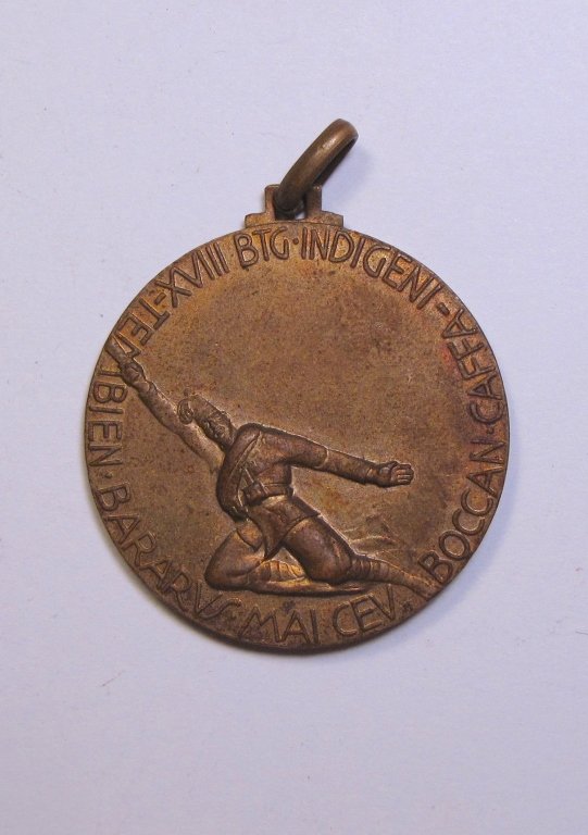 Italian 18th Battalion Medal Ethiopia1935-36: Italian 18th Battalion Medal Ethiopia1935-36. The obverse of the medal feauturing jumping soldiar and sifned "XVIII Btg. Tembien Bararus Mai Cev Boccan Caffa Indigeni", the reverse is depicting army o