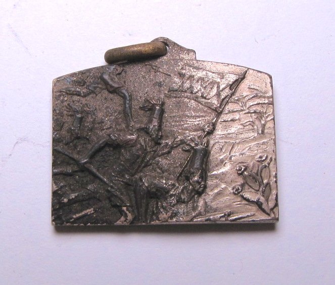 Medal of 39th Battalion of Colonial Africa: Silver tone medal of 39th Battalion of Colonial Africa. The obverse is depicting attacking soldiers caring a flag signed "XXXIX". The reverse is depicting a shield and crossed weapons on the left side