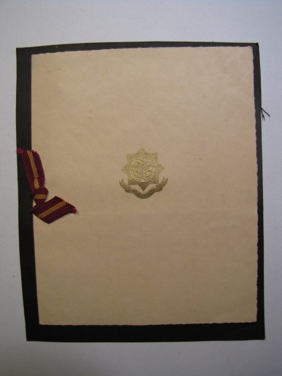 The Shanghai Volunteer Corps Christmas Card: The Shanghai Volunteer Corps Christmas Card. The front cover featuring SVC gold embodied seal and burgundy / gold ribbon. On the inside it signed by hand on the right side "Archee Douglas / This Shang