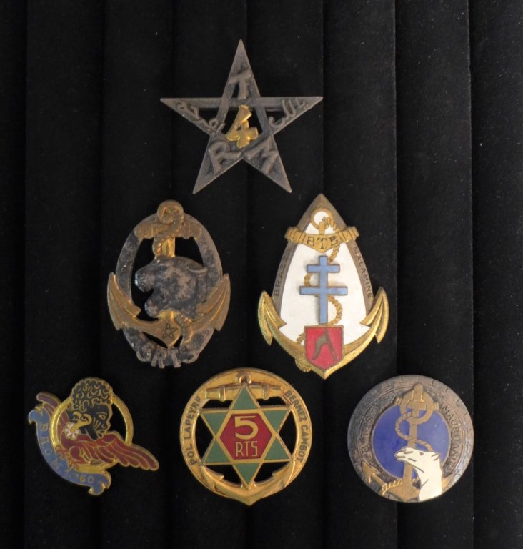 Badges of The Senegalese Riflemen: Six assorted French Foreign Legion badges from the Senegalese Riflemen. Includes: Regimental badge 5 th Regiment of Riflemen Senegalese, BRAZZAVILLE badge Battalion Rifle Troops Colonial, INSIGNE4 th 