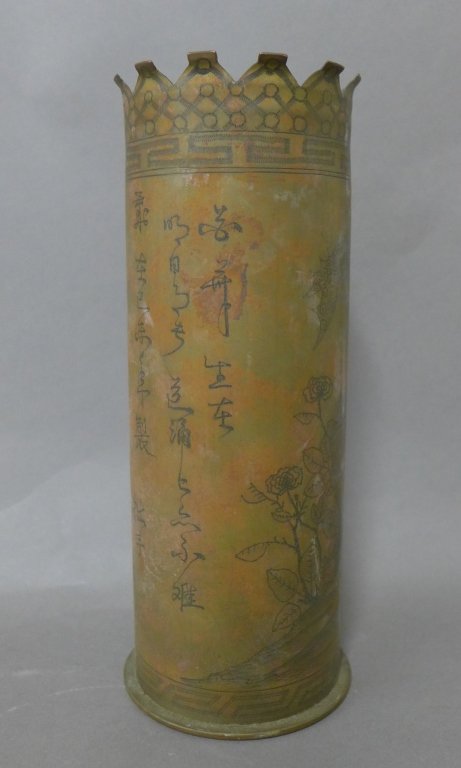 Trench Art Artillery Shell Vase China 1930s: Trench art artillery shell vase China 1930s. Featuring delicate floral engraved decoration around the shell with graphic boarder at the bottom and the top. Has three vertical lines of characters. At t