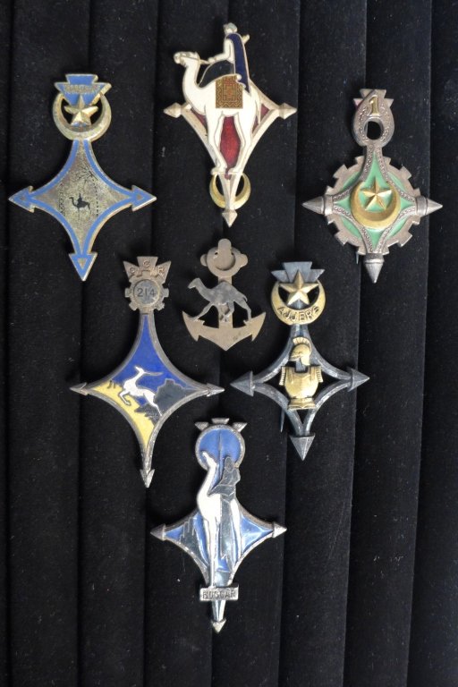 French Foreign Legion Badges of the Saharan: Collection of 7 assorted French Foreign Legion Badges of the Saharan. Includes: C.M.T.H., Genie Ajjers, Touggourt, Cie Mehariste De Mariksene, Patent Camel Corps of Colonial Troops and Sahara. 1 Compa